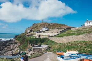 a cliffside group of homes in cornwall undergoing slope stability survey