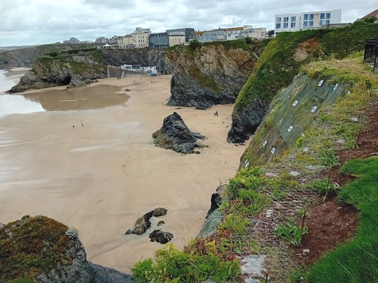 Towan Beach Newquay - with rock mesh and anchors to upper slope face. Rockfall and landslide protection measures.